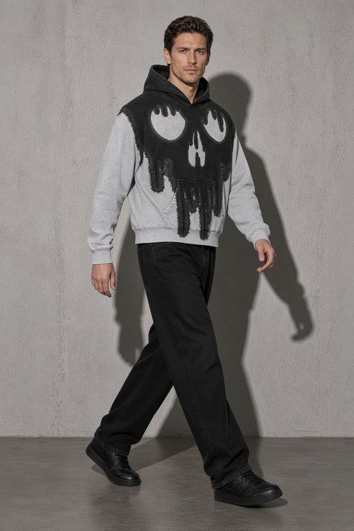 Dripping skull men's black hoodie, full-body view
