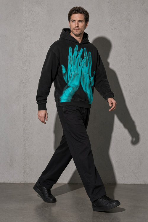 Turquoise ghost hands men's black hoodie, full-body view
