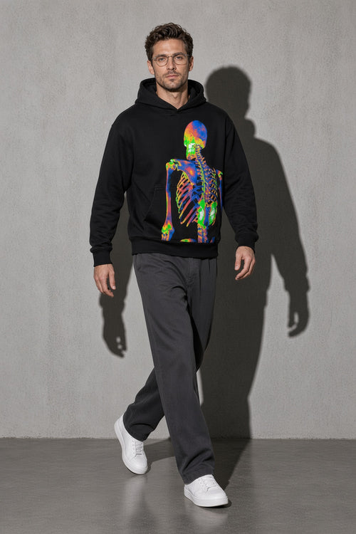 Men's black neon skeleton graphic hoodie walking view