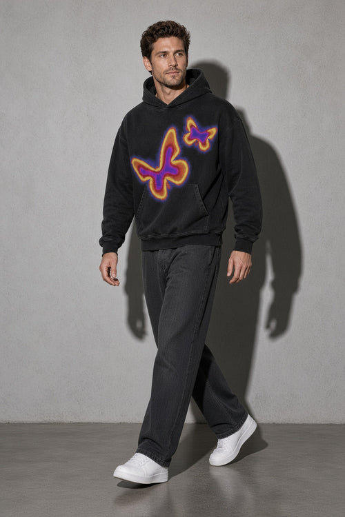 Men's black neon butterfly graphic hoodie walking view